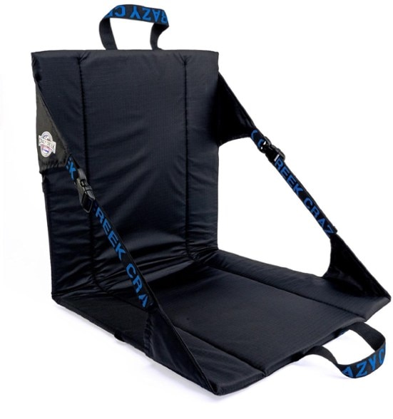 UltraLite camping chair set up at a beach, showcasing its waterproof material and comfort features.