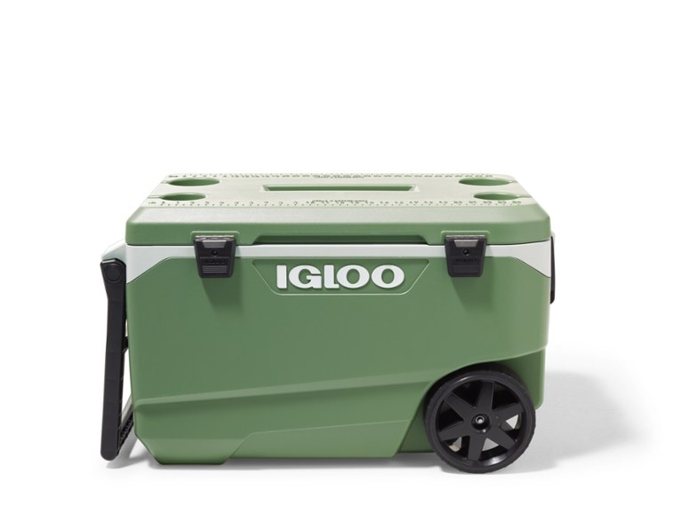 Igloo ECOCOOL wheeled cooler on rocky terrain, showing all-terrain wheels and tow handle
