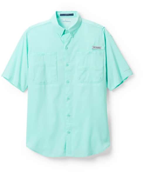 Front view of a man wearing a light blue Columbia PFG Tamiami II shirt, showcasing the chest pockets and relaxed fit.