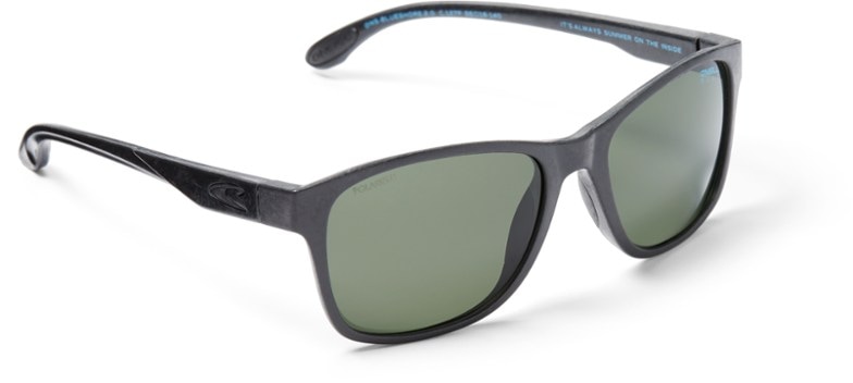 Eco-friendly polarized sunglasses showcasing a green frame near water, emphasizing sustainability and style.