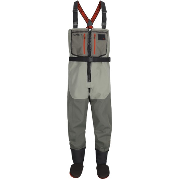 Men's breathable fishing waders in action by the river, showing flexibility and comfort.
