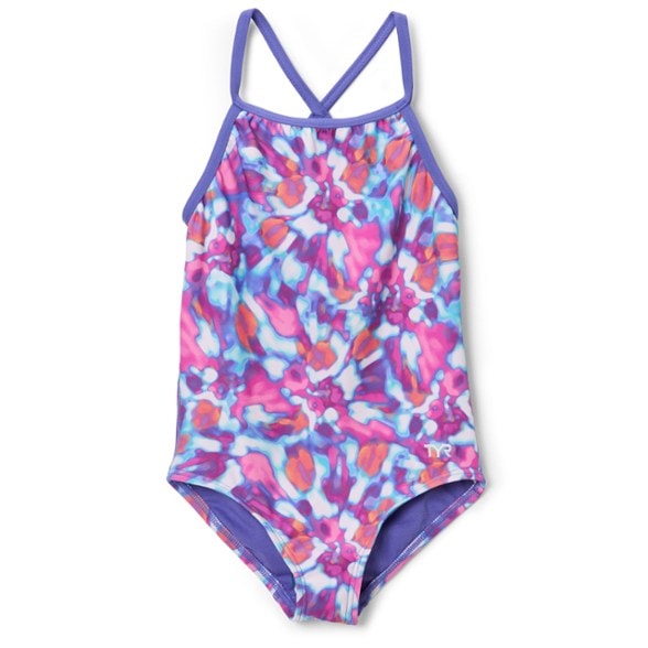 Young girl happily swimming laps in a vibrant TYR Addy Diamondfit one-piece swimsuit, showcasing its ergonomic design and freedom of movement.