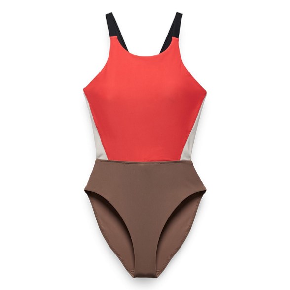 PrAna Baja Bound women's cutout swimsuit in action at the beach showing the high-leg cut and back detail