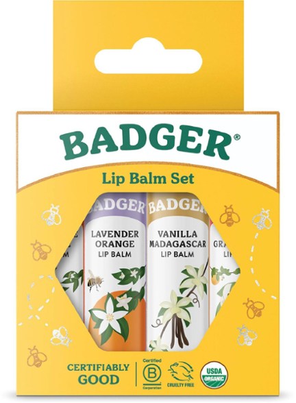 Natural Harmony Organic Lip Balm Set with four flavors - Tangerine Breeze, Lavender Orange, Vanilla Madagascar, and Pink Grapefruit.