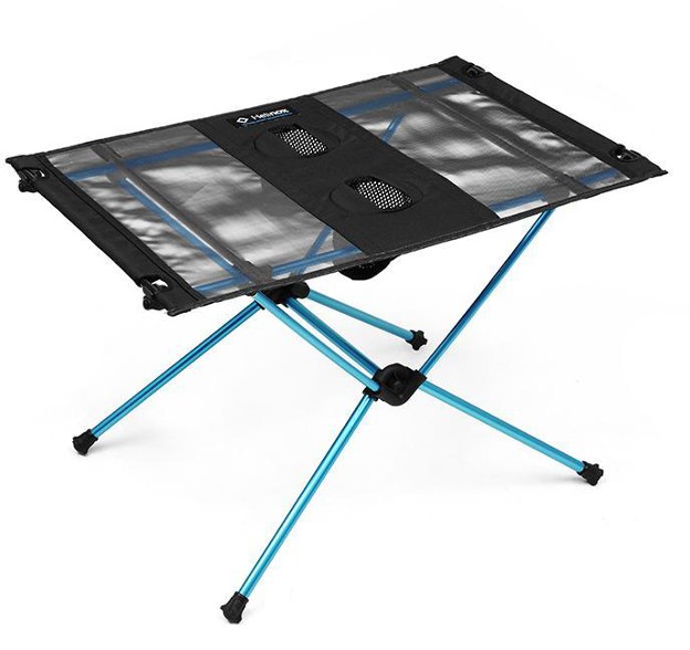 Helinox Table One showing its lightweight design and cup holders for outdoor picnics