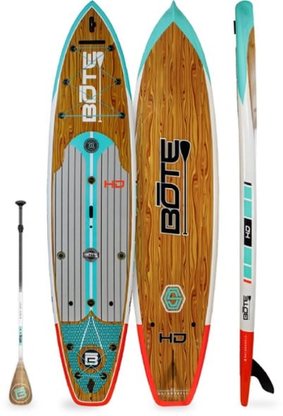 Angler casting from BOTE HD Gatorshell paddle board in calm waters