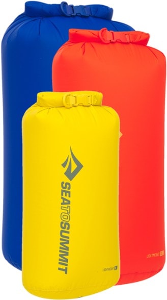 AdventureReady lightweight dry bag set on a riverbank, perfect for kayaking.
