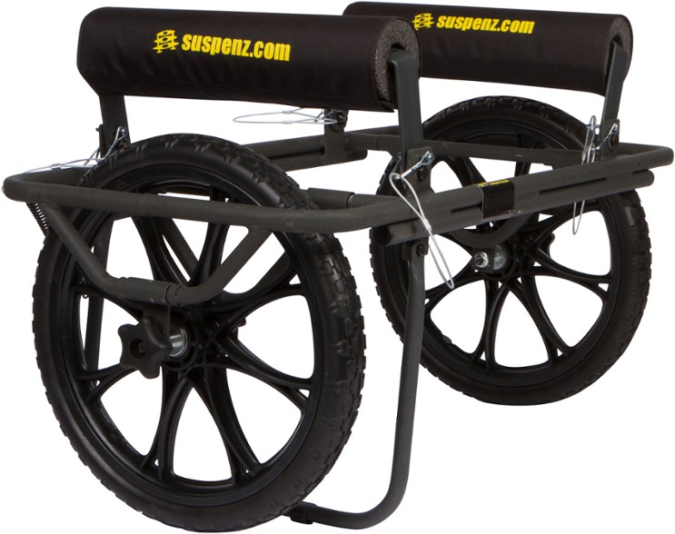 Suspenz Apex all-terrain cart fully assembled, ready to transport a kayak on a sandy beach.