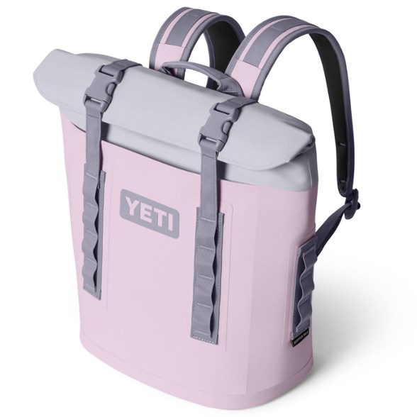 YETI Hopper M12 Backpack Cooler with wine bottles, highlighting leakproof insulation and durable exterior.
