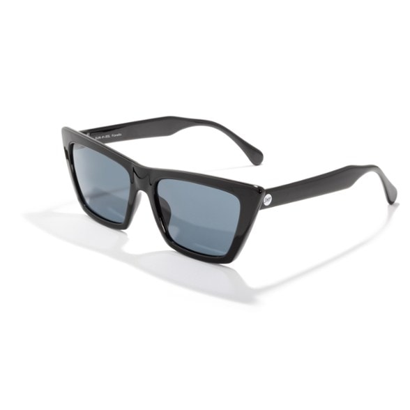 Woman wearing Fiorella cat-eye sunglasses outdoors, showcasing polarized lens clarity.
