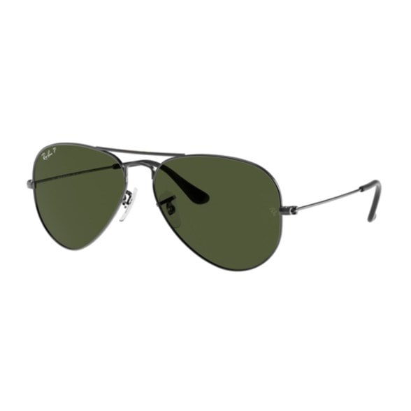 Ray-Ban Aviator sunglasses displayed on a wooden table from the side, showing the detail of the polarized lenses.