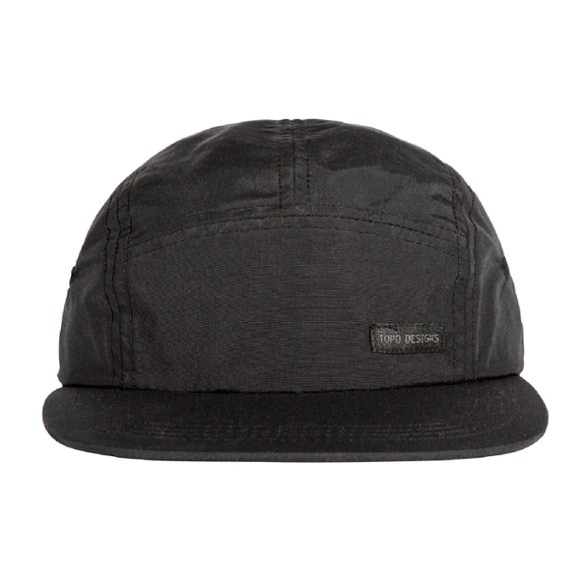 Front view of the lightweight water-repellent nylon camping cap on a hiking trail.