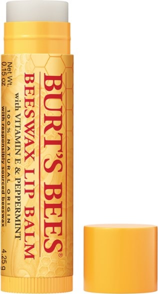 Close-up of Peppermint Beeswax Lip Balm tube on white cotton cloth – showcasing Moisturizing Lip Balm packaging.