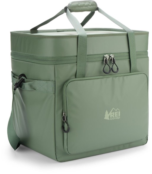 A person casually carrying the Trailblazer 30L soft sided cooler with its padded shoulder strap, showing its portable design for weekend trips.