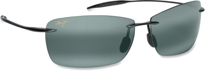 Maui Jim Lighthouse polarized sunglasses in a stylish root beer color with bronze lenses at the beach.