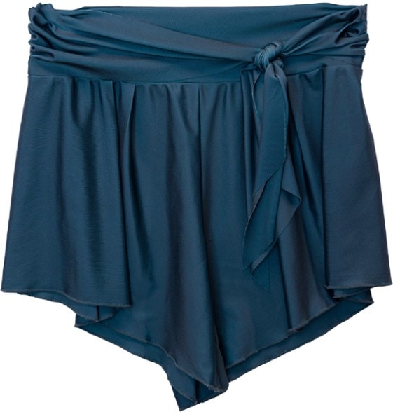 Woman wearing Nani swim romper shorts at beach showing UPF 50 tag and tie waist detail