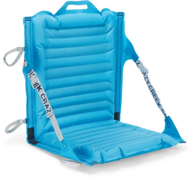 Side view of the Crazy Creek AirCliner chair fully inflated on a forest trail