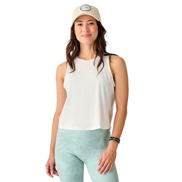 Women's activewear top for beach adventures, showing the tank top's relaxed fit and cropped silhouette.