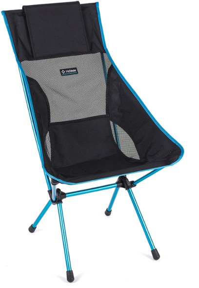 Helinox Sunset Reclining Camp Chair in use at a campsite, showcasing its comfort and portability