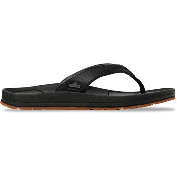 Close-up of Rosa women's flip-flops with adjustable straps on sandy beach