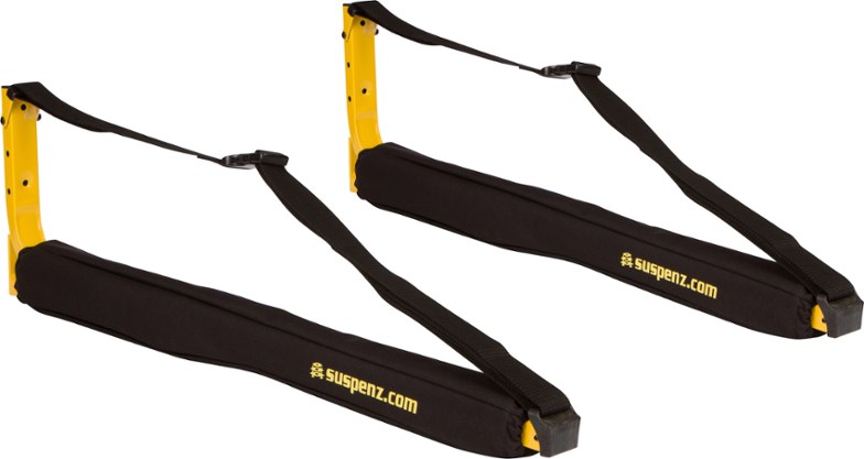 Wall-mounted canoe rack with safety straps and foam padding for secure outdoor storage