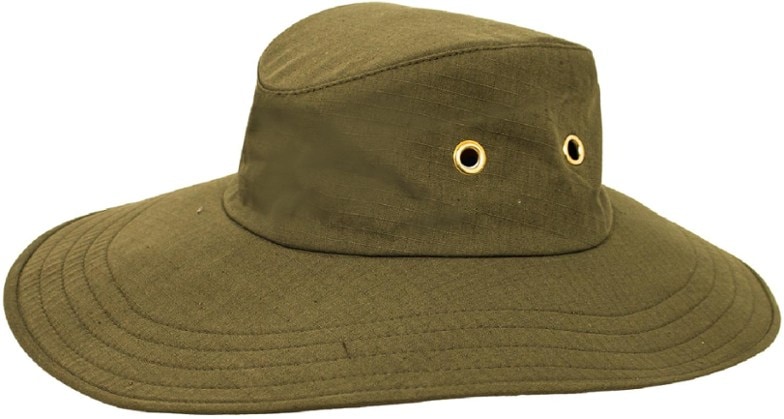 A person wearing the Horizon Wanderer UV protection wide brim hat, looking out over a sunny landscape, showcasing its wide brim and elegant design.