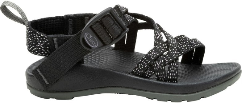 Kids wearing eco-friendly outdoor sandals with adjustable straps on a summer trail