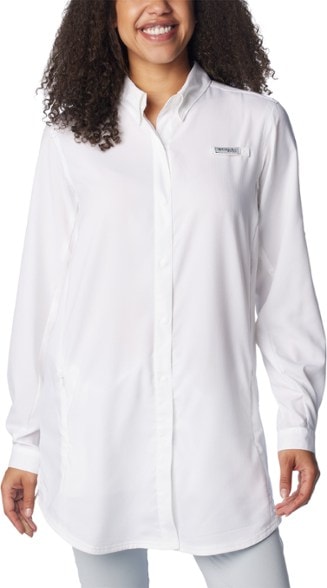 Columbia PFG Tamiami women's fishing shirt worn on a boat, showcasing UPF 40 sun protection