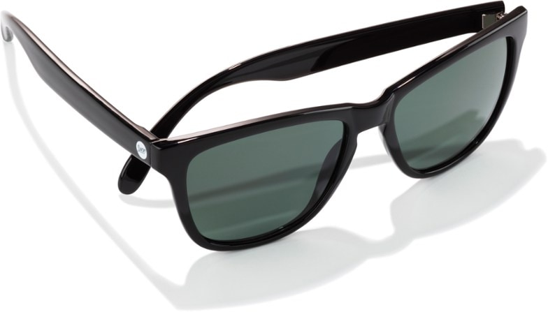 Woman wearing Headlands classic wayfarer sunglasses with a low bridge fit, enjoying a sunny outdoor setting.