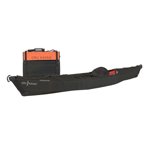 Oru Beach LT folding kayak beautifully laid out on a calm lake, highlighting its origami-inspired structure.