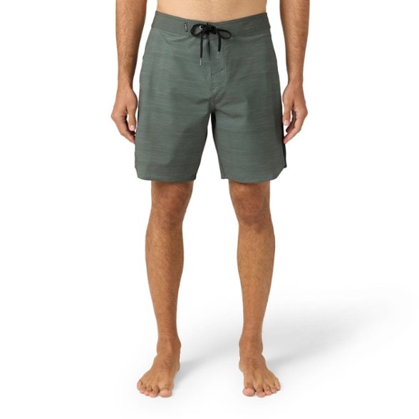 O'Neill men's board shorts in action at the beach, showcasing their quick-dry technology.