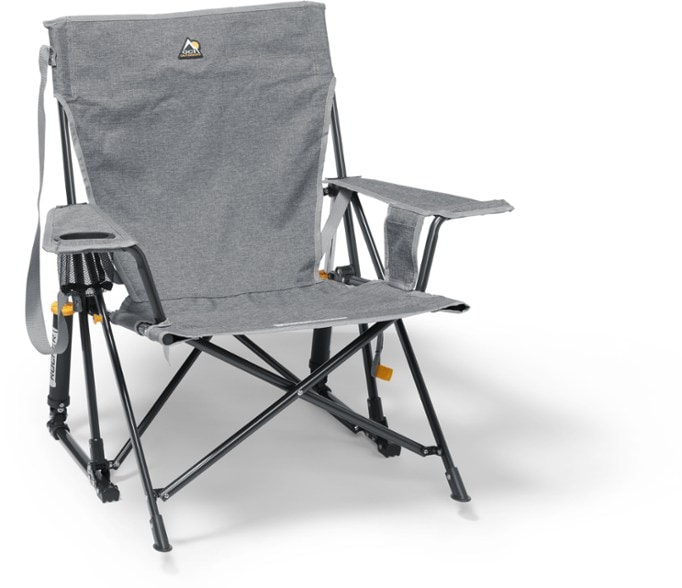 Side view of TrailEase Kickback Rocker Pro set up on rocky terrain, showing cup holder and phone pocket