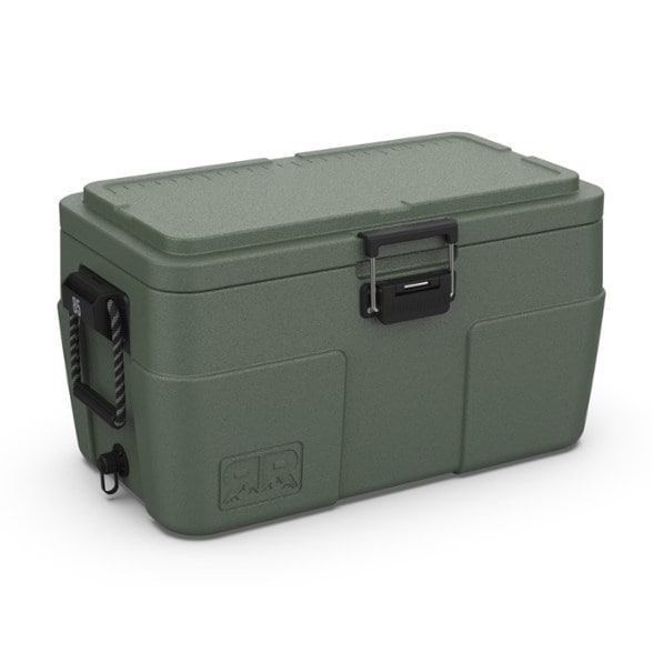 SummitChill 85L Explorer Cooler positioned in a lush green campsite, showcasing its rugged, durable exterior and size.