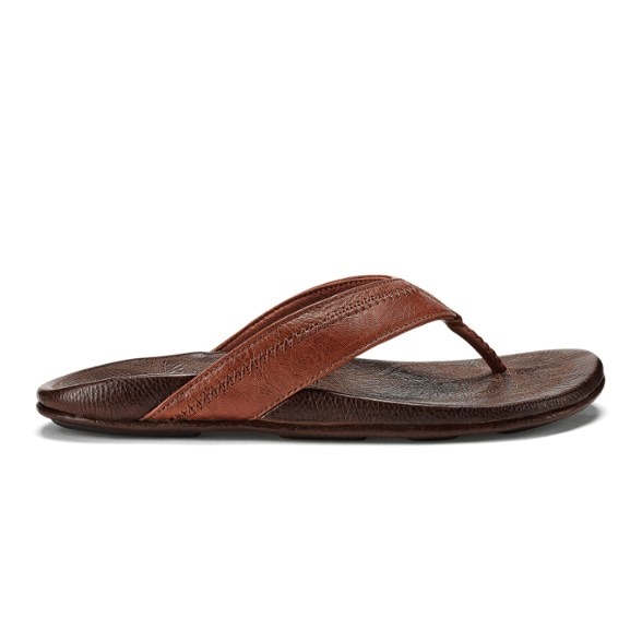 OluKai Hiapo men's flip-flops showing the full-grain leather design and Moko tattoo artwork.