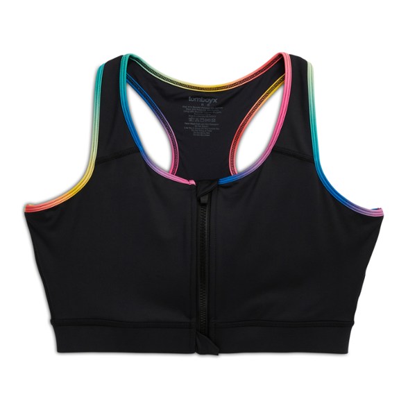 Athletic woman wearing the zip swimsuit top during beach volleyball