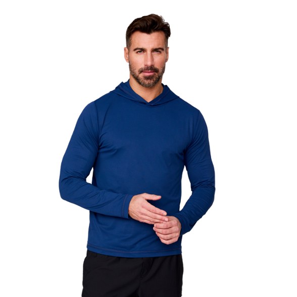 Men modeling the SunFree UPF 50+ hoodie outdoors, showcasing thumbholes and long sleeves.