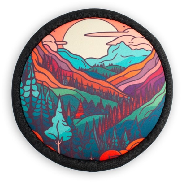 Child playing with mini flyer disc in park — backpack disc for family picnics