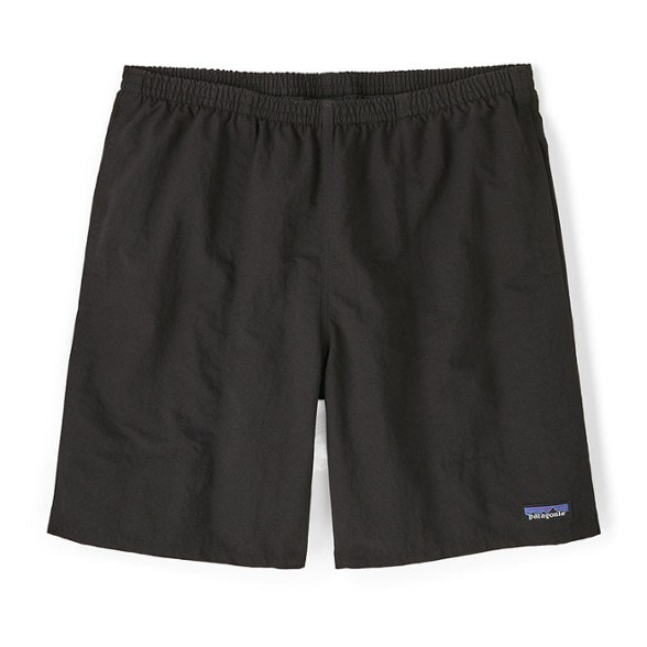 Patagonia Baggies Longs 7-inch swim shorts in action at the beach with a surfer.