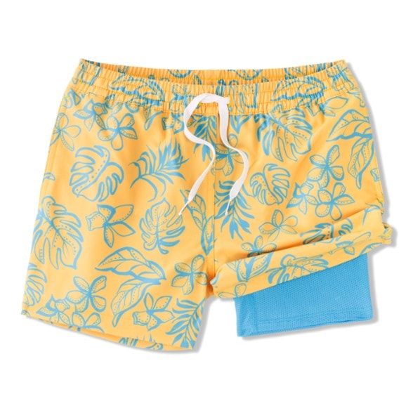 Chubbies kids swim trunks in action at the beach, showcasing quick-dry functionality.