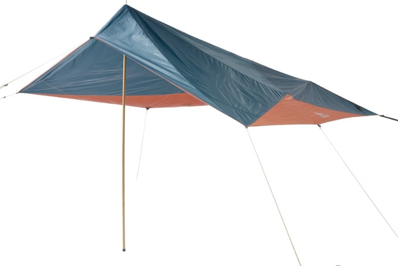 Versatile Vehicle Canopy Tarp set up at a campsite, showcasing its robust pole structure.