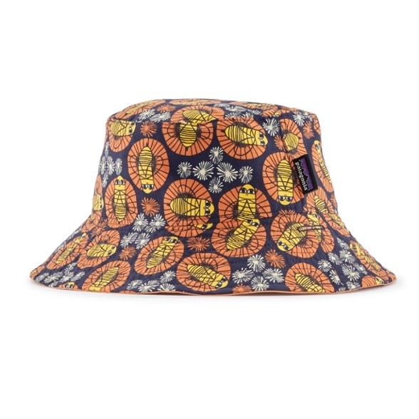 Front view of baby sun hat worn by toddler at beach with brim extended for sun protection