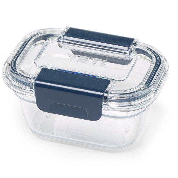 Angled view of YETI TrailSnacks container filled with almonds inside a Daytrip cooler.