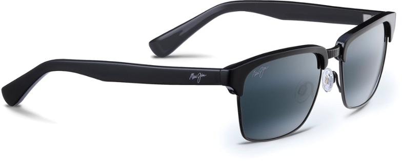 Maui Jim Kawika Polarized Sunglasses on a wooden surface, showcasing their vintage design