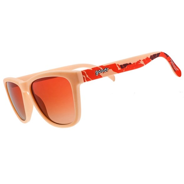 Grand Canyon polarized sunglasses modeled outdoors, showing tan frame and orange lenses