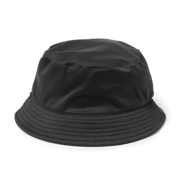 Front view of the satin-lined waterproof bucket hat in a stylish outdoor setting.