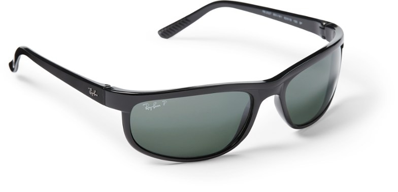 Front view of Ray-Ban Predator 2 polarized sunglasses on a sandy beach.