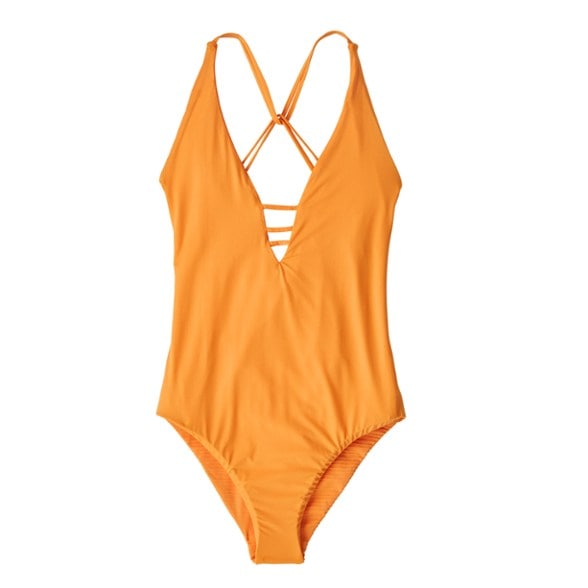 Rear view of the reversible swimsuit showing strap placement and seat coverage.