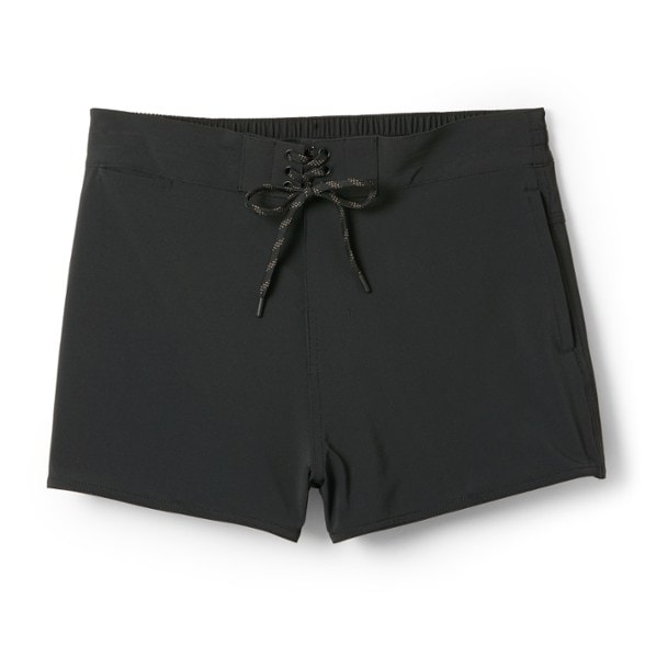 Vintage Wave Women's Board Shorts displayed at the beach, showcasing the quick-dry fabric.