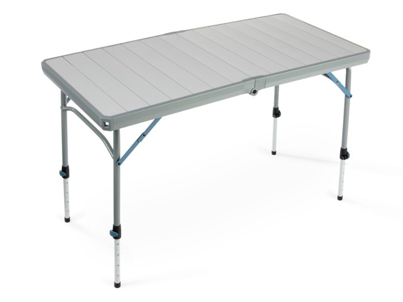 Adjustable height camping table set up at a campsite with food preparation.
