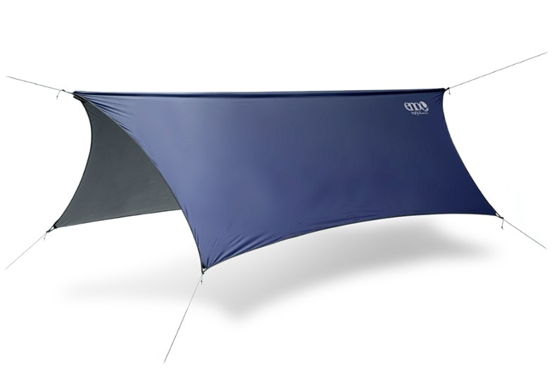 ProFly XL hammock tarp set up over a hammock, showcasing its spacious coverage in a forest setting.